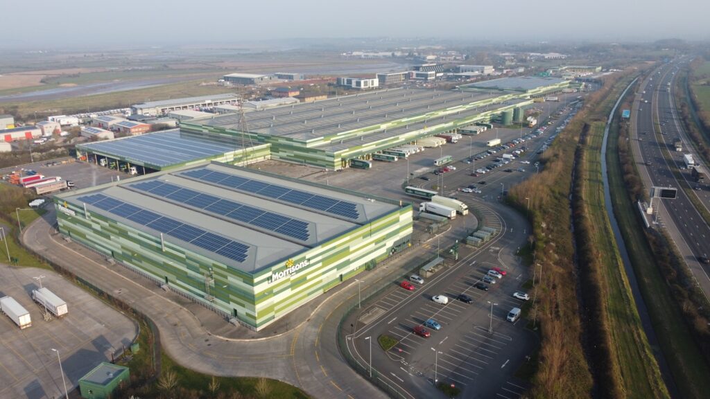 An aerial view of a parking lot and a highway